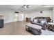 Spacious living area with multiple seating options, table and chairs, and hardwood floors at 3380 Pawleys N Loop, St Cloud, FL 34769