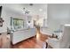 Open-concept living room featuring comfortable seating and modern decor at 3380 Pawleys N Loop, St Cloud, FL 34769