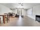 Spacious living room with a projector screen, a ceiling fan, and comfortable seating at 3380 Pawleys N Loop, St Cloud, FL 34769