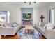 Inviting living room with fireplace, mounted TV, and comfortable seating at 3380 Pawleys N Loop, St Cloud, FL 34769
