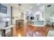Open-concept living space with a dining area and a kitchen, showcasing an inviting atmosphere at 3380 Pawleys N Loop, St Cloud, FL 34769