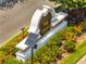 Community entrance sign with vibrant landscaping and solar powered lighting at 3380 Pawleys N Loop, St Cloud, FL 34769