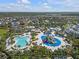 Aerial view of the resort style community featuring an impressive waterpark and various pools at 341 Falls Dr, Kissimmee, FL 34747
