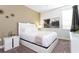 Comfortable bedroom showcases neutral decor with a sleek nightstand and modern artwork at 341 Falls Dr, Kissimmee, FL 34747