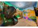 Themed bedroom with a slide, creative murals, and custom lighting at 341 Falls Dr, Kissimmee, FL 34747