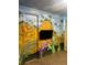 The whimsical themed bedroom features custom Avatar themed artwork and detailed wall paintings at 341 Falls Dr, Kissimmee, FL 34747