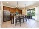 Well-appointed kitchen with stainless steel appliances, granite countertops, and a breakfast bar at 341 Falls Dr, Kissimmee, FL 34747