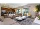 Open-concept living room with modern furniture, neutral tones, and plenty of natural light at 341 Falls Dr, Kissimmee, FL 34747