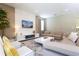 Bright and modern living room with comfortable seating, contemporary decor, and ample natural light at 341 Falls Dr, Kissimmee, FL 34747