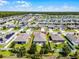 Aerial view showing home in relation to the neighborhood and nearby lake at 3519 Fernanda Dr, Deltona, FL 32738