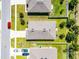 An aerial view highlights the property's roof, landscaping, and neighborhood layout at 3519 Fernanda Dr, Deltona, FL 32738