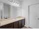 Well-lit bathroom features dark cabinets and ample counter space and a single sink at 3519 Fernanda Dr, Deltona, FL 32738