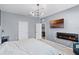 Bedroom features a sleek electric fireplace and a mounted TV across from a tufted bed at 3519 Fernanda Dr, Deltona, FL 32738