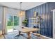 Inviting dining room with stylish decor and a sliding door that leads to a patio at 3519 Fernanda Dr, Deltona, FL 32738