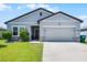 Charming single-Gathering home with a well-manicured lawn, neutral siding, and a spacious two-car garage at 3519 Fernanda Dr, Deltona, FL 32738