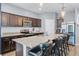 Spacious kitchen with stainless steel appliances, granite countertops, and seating at the island at 3519 Fernanda Dr, Deltona, FL 32738