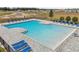 A large community swimming pool with lots of seating areas and lounging chairs at 3981 Great Smokey Way, Apopka, FL 32712
