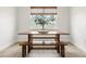 Bright dining area with natural light, featuring a rustic wooden table and bench at 3981 Great Smokey Way, Apopka, FL 32712
