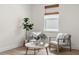 Cozy sitting area with natural light, modern decor and wood-look flooring at 3981 Great Smokey Way, Apopka, FL 32712