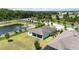 Well-situated home offering a scenic view with a vast lawn and views of a tranquil pond from above at 4119 Sunset Preserve Blvd, Orlando, FL 32820