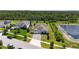 Desirable home with a manicured lawn, long driveway and in close proximity to a pond, viewed from an aerial angle at 4119 Sunset Preserve Blvd, Orlando, FL 32820