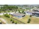 Picture of a house with a large lawn and pond, enhanced by an aerial view that captures the full extent of the property at 4119 Sunset Preserve Blvd, Orlando, FL 32820