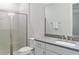 Modern bathroom featuring a glass-enclosed shower, toilet, and a single-sink vanity with a gray countertop at 4119 Sunset Preserve Blvd, Orlando, FL 32820