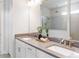 Bathroom vanity featuring dual sinks, modern fixtures, and a large mirror at 4119 Sunset Preserve Blvd, Orlando, FL 32820