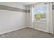 Bedroom featuring a horizontal stripe accent wall and a large window at 4119 Sunset Preserve Blvd, Orlando, FL 32820