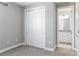 Bedroom with a sliding closet door and an open bathroom at 4119 Sunset Preserve Blvd, Orlando, FL 32820