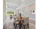Elegant dining area flows into a spacious living room with large windows at 4119 Sunset Preserve Blvd, Orlando, FL 32820