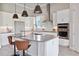 Spacious kitchen with a large island, stainless steel appliances, and ample countertop space at 4119 Sunset Preserve Blvd, Orlando, FL 32820