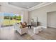 Bright living room with tile floors, modern furniture, and large sliding glass doors at 4119 Sunset Preserve Blvd, Orlando, FL 32820