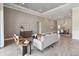 Bright, open living room with modern decor, recessed lighting, and elegant tile flooring at 4119 Sunset Preserve Blvd, Orlando, FL 32820
