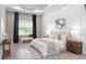 Serene main bedroom with tray ceiling, accent wall, and large window at 4119 Sunset Preserve Blvd, Orlando, FL 32820