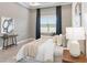 Relaxing main bedroom with neutral tones, accent wall art, and natural light at 4119 Sunset Preserve Blvd, Orlando, FL 32820