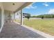Outdoor kitchen and patio area overlooking a large yard at 4119 Sunset Preserve Blvd, Orlando, FL 32820