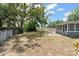 Expansive backyard with mature trees providing ample shade and privacy at 439 Sunrise Ct, Orlando, FL 32803
