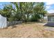 Large backyard with mature trees and a partially fenced perimeter at 439 Sunrise Ct, Orlando, FL 32803