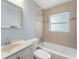 Updated bathroom features tiled walls, tub, modern fixtures, and natural light at 439 Sunrise Ct, Orlando, FL 32803