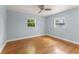 Bedroom featuring hardwood floors and natural light from two windows at 439 Sunrise Ct, Orlando, FL 32803