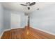 Bedroom with hardwood floors, closet, and a ceiling fan at 439 Sunrise Ct, Orlando, FL 32803