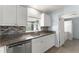 Close-up of the kitchen with granite counter tops and stainless steel dishwasher at 439 Sunrise Ct, Orlando, FL 32803