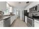 Updated kitchen with stainless steel appliances and granite countertops at 439 Sunrise Ct, Orlando, FL 32803