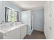 Bright laundry room with a washer, dryer, and ample storage cabinets at 439 Sunrise Ct, Orlando, FL 32803