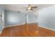 Open living room with wood floors and blue accent walls at 439 Sunrise Ct, Orlando, FL 32803