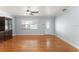 View of living room with ceiling fan, front door and window at 439 Sunrise Ct, Orlando, FL 32803