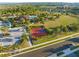 An aerial view of the community amenities including pool, basketball court, and green space at 488 Kistler Cir, Clermont, FL 34715