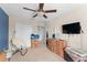 Bedroom with blue wall and ample floor space for moving boxes at 488 Kistler Cir, Clermont, FL 34715
