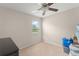 Cozy bedroom with a view of the outdoors through a bright window at 488 Kistler Cir, Clermont, FL 34715